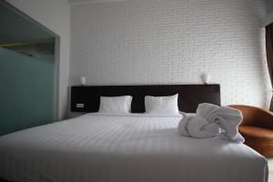 Postel nebo postele na pokoji v ubytování Xtra Hotel Bengkulu