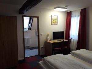 TV a/nebo společenská místnost v ubytování Hotel Luca