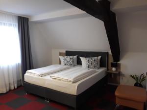 Postel nebo postele na pokoji v ubytování Hotel Luca