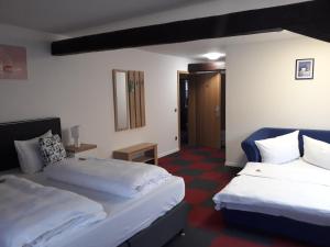 Postel nebo postele na pokoji v ubytování Hotel Luca