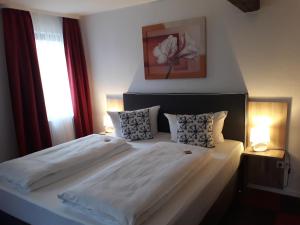 Postel nebo postele na pokoji v ubytování Hotel Luca