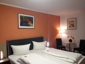Postel nebo postele na pokoji v ubytování Hotel Luca