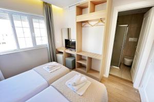 Łóżko lub łóżka w pokoju w obiekcie Alis Hotel