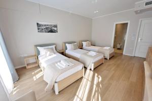 Łóżko lub łóżka w pokoju w obiekcie Alis Hotel
