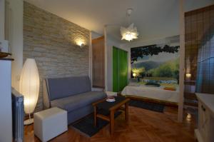 a living room with a couch and a bed at Cozy apartment Ernesto*good location*Rovinj in Rovinj