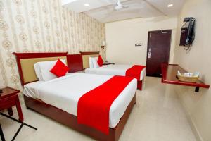 Postel nebo postele na pokoji v ubytování Hotel President
