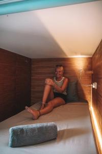 Postel nebo postele na pokoji v ubytování Kaniu Capsule Hostel