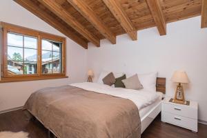 Ein Bett oder Betten in einem Zimmer der Unterkunft Chalet Monte Cristo