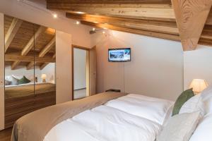 Postel nebo postele na pokoji v ubytování Chalet Monte Cristo