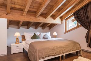 Postel nebo postele na pokoji v ubytování Chalet Monte Cristo