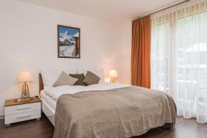 Postel nebo postele na pokoji v ubytování Chalet Monte Cristo