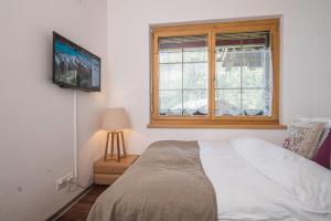 Postel nebo postele na pokoji v ubytování Chalet Monte Cristo