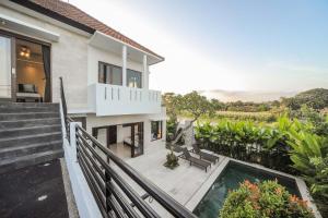 an aerial view of a house with a swimming pool at Villa Rindik Sanur in Sanur