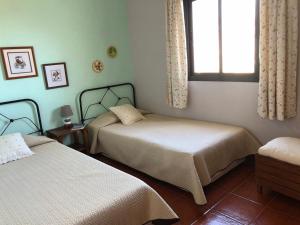 Кровать или кровати в номере La Casita