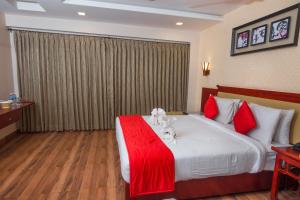 Postel nebo postele na pokoji v ubytování Hotel President