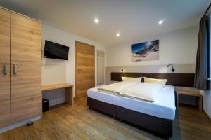 Postel nebo postele na pokoji v ubytování Fernerblick Apartments