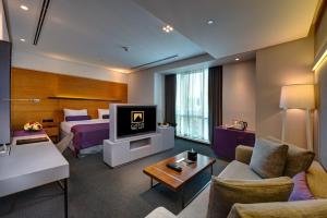 TV o dispositivi per l'intrattenimento presso The Act Hotel Sharjah