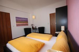 Postel nebo postele na pokoji v ubytování Stadthotel Kleiner Berg