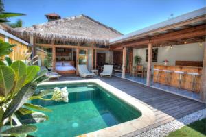 an image of a villa with a swimming pool at Kempas Villa in Gili Air