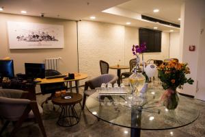 a room with a glass table with flowers on it at Sparkle Hotel in Istanbul