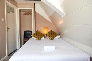 Postel nebo postele na pokoji v ubytování ITC Hotel