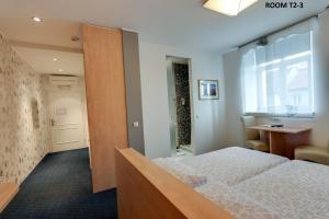 Cama o camas de una habitación en Marta Studios & Rooms