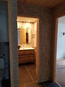 a bathroom with a sink and a mirror at Chez Papy - Grand Appart Entirely renovated Ventelon La Grave La Meije in La Grave