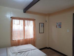Postel nebo postele na pokoji v ubytování home stay rizalina