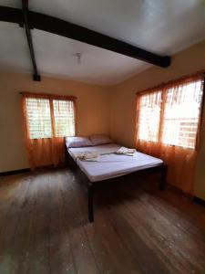 Postel nebo postele na pokoji v ubytování home stay rizalina