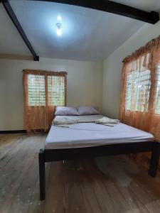 Postel nebo postele na pokoji v ubytování home stay rizalina