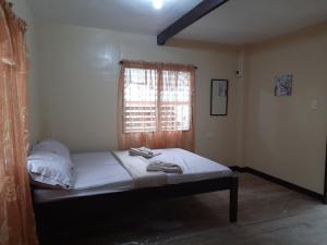 Postel nebo postele na pokoji v ubytování home stay rizalina