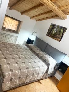 A bed or beds in a room at Rooms Teatro Greco