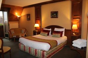 Postel nebo postele na pokoji v ubytování Hotel Le Mandelberg