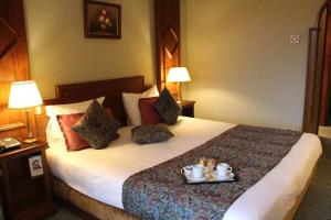 Postel nebo postele na pokoji v ubytování Hotel Le Mandelberg