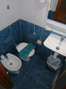 a bathroom with a toilet and a sink at B&B Da Roberto in Naples