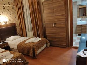 Postel nebo postele na pokoji v ubytování Hotel Bazaar