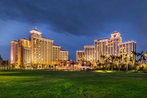 a view of a resort with palm trees and a field at Grand Hyatt Baha Mar in Nassau