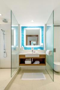 a bathroom with a sink and a shower at Grand Hyatt Baha Mar in Nassau