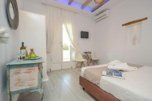 Valena Mare Suites & Apartments客房内的一张或多张床位