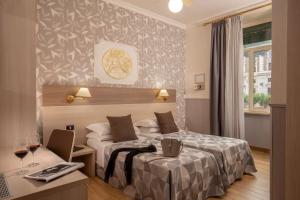 Ένα ή περισσότερα κρεβάτια σε δωμάτιο στο Hotel Dorica