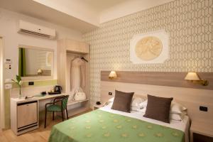Ένα ή περισσότερα κρεβάτια σε δωμάτιο στο Hotel Dorica