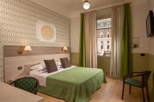 Ένα ή περισσότερα κρεβάτια σε δωμάτιο στο Hotel Dorica