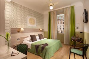 Postel nebo postele na pokoji v ubytování Hotel Dorica