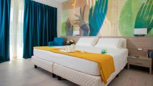 Cama ou camas em um quarto em Hotel President