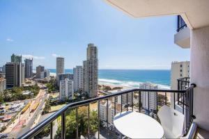 a balcony with a view of the beach and buildings at Surfers Ocean View Sleeps 4, Free WIFI, Washing Machine, Large Fridge in Gold Coast