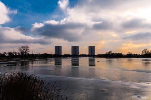 a body of water with buildings in the background at Ferienwohnungen-Neue-Tiefe-Wohnung-Kleiderbuegel in Neue Tiefe Fehmarn