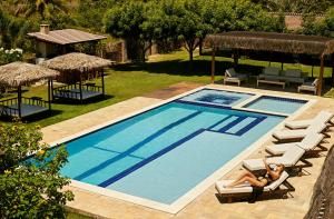 The swimming pool at or close to Vila Emanuelle Pousada Boutique