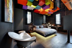 Ένα ή περισσότερα κρεβάτια σε δωμάτιο στο STABLE HOTEL