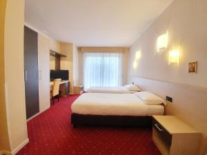 Posteľ alebo postele v izbe v ubytovaní Hotel Ristorante al Giardinetto