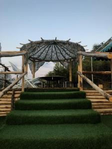 a set of stairs with a table and an umbrella at B&B Profumi di Sicilia in San Cataldo